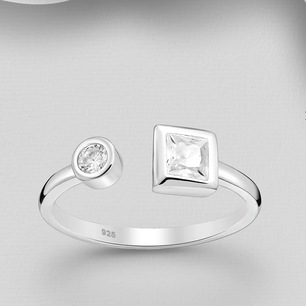Sterling silver adjustable ring with one round clear crystal and one square colored crystal, comes with gift box.
