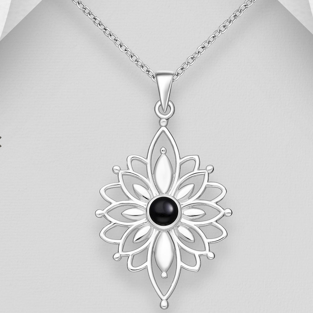 Silver necklace with a floral pendant featuring a black gemstone on a silver background